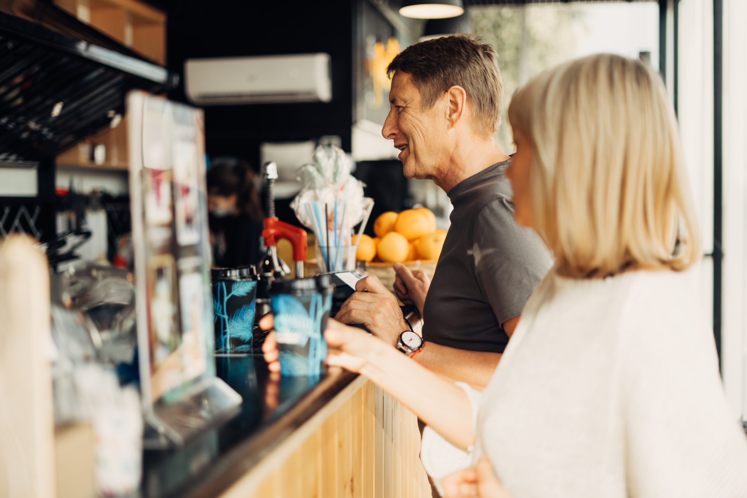 Man ordering at the bar.